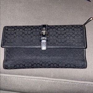Coach black trifold wallet. Good condition.